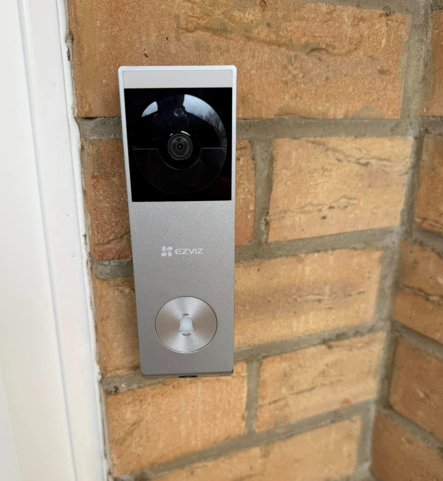 Person using a contactless reader to open an office door